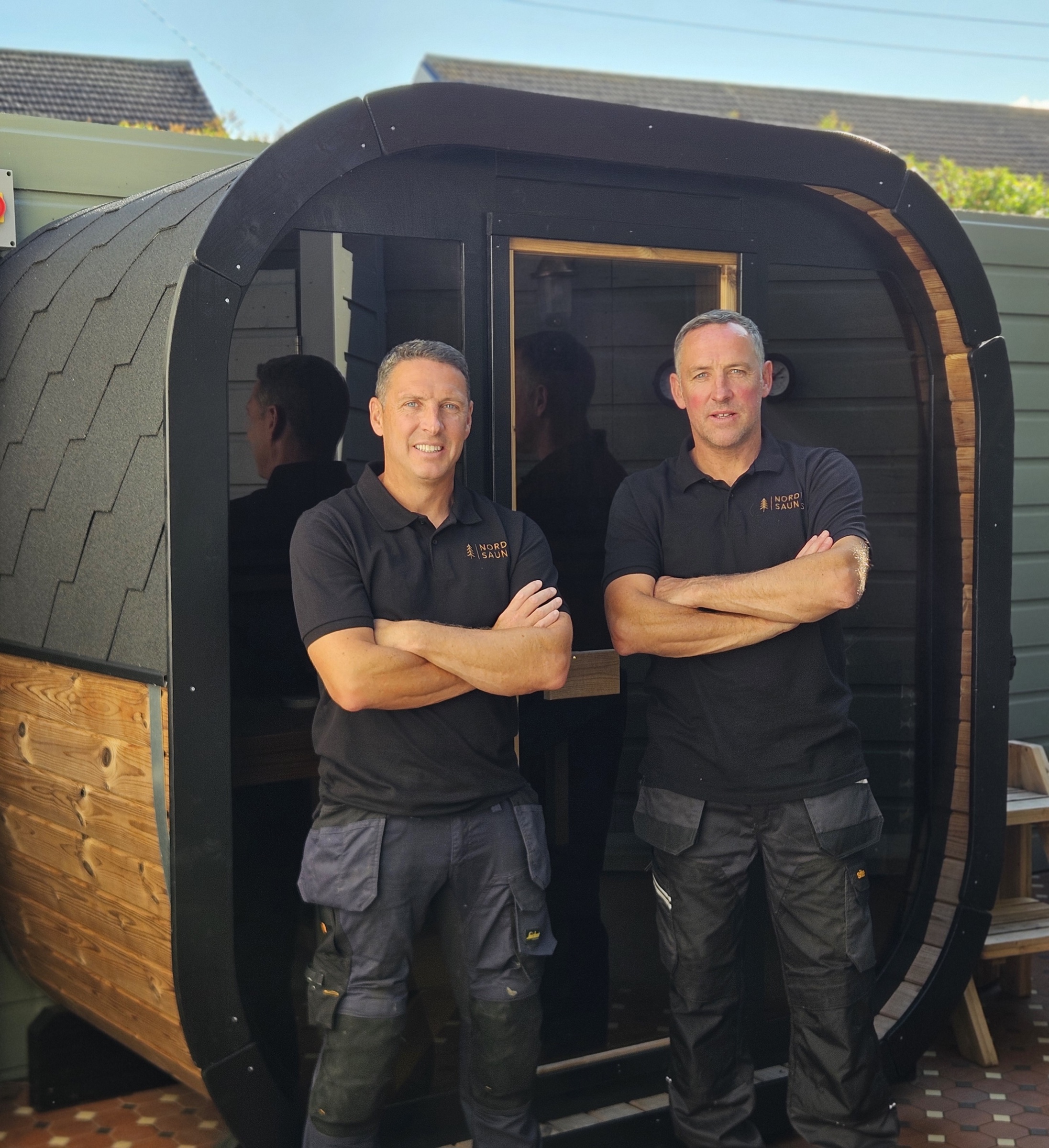 Simon and Jason in front of a Nordic Saunas garden sauna