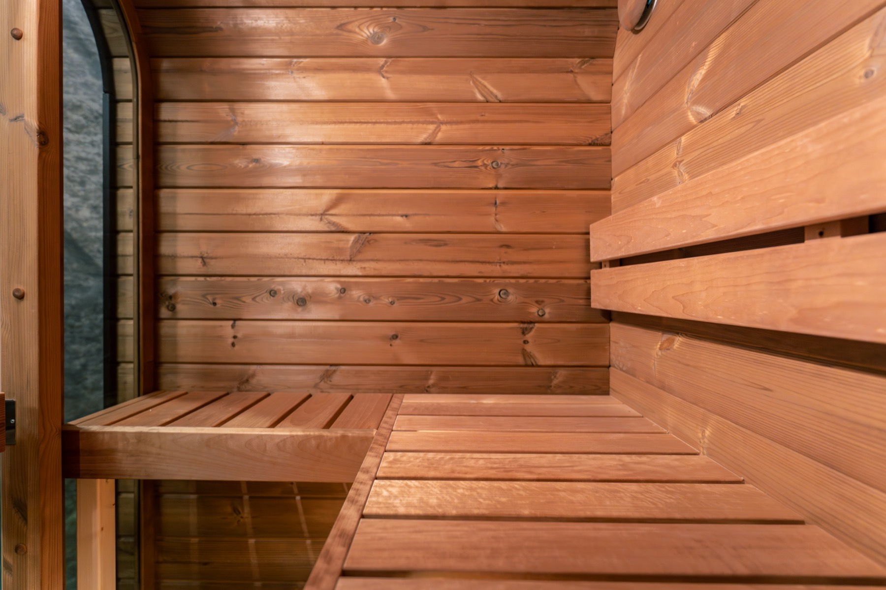Nordic pine benches inside a Nordic Saunas cube sauna